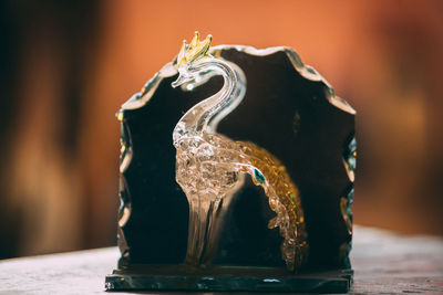 Close-up of carving on table