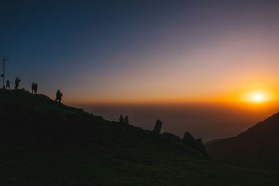 Scenic view of silhouette landscape against clear sky during sunset