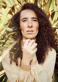 Portrait of woman against plants