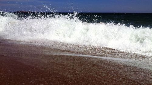 Waves splashing on shore