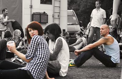 Group of people sitting in front of building