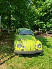 Yellow vintage car on field