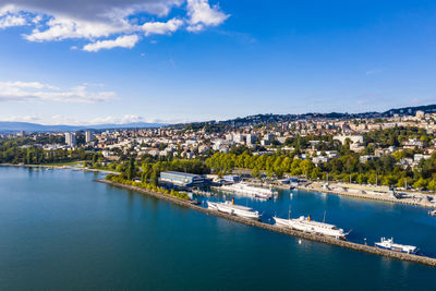 High angle view of townscape and river against sky