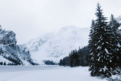 Scenic view of snow covered mountains against sky