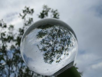 Low angle view of street light against sky