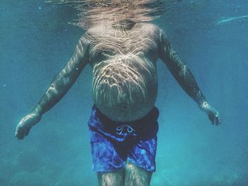 Man swimming in sea