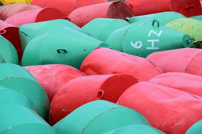 Full frame shot of red and green buoys