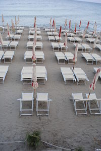 Chairs on beach by sea