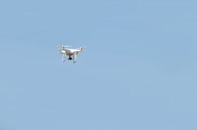 Low angle view of airplane flying in sky