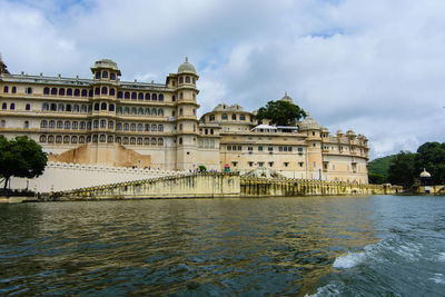 View of buildings against cloudy sky