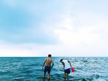 Rear view of man on beach