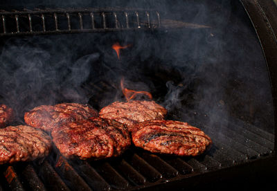 Close-up of meat on barbecue grill