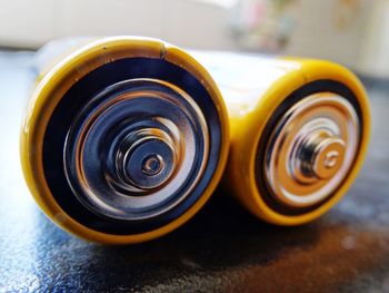 Close-up of batteries on table