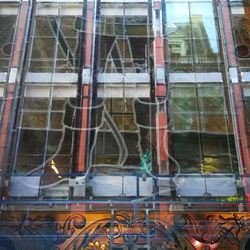 Reflection of building on glass window