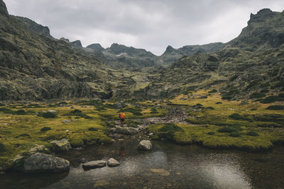 A young man looks at his objetive to hike in sierra de gredos, spain