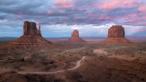 Rock formations on landscape against sky