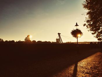 View of street light against sky at sunset