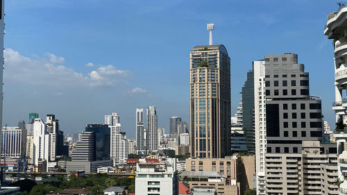 Modern buildings in city against sky