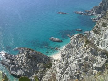 High angle view of sea against blue sky