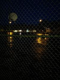 Chainlink fence at night