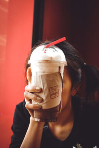 Close-up of woman holding ice cream