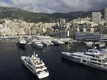 High angle view of harbor by sea against sky