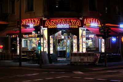 Illuminated city street at night