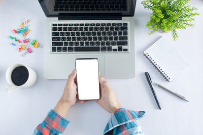 High angle view of mobile phone on table