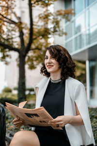 Young woman sitting outdoors