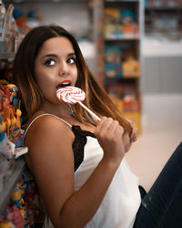 Portrait of woman holding ice cream