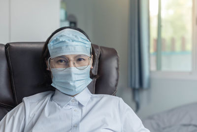 Portrait of man wearing mask