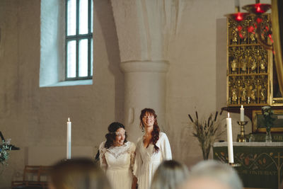 Brides at wedding ceremony