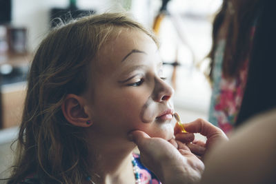 Close-up of girl wearing face paint