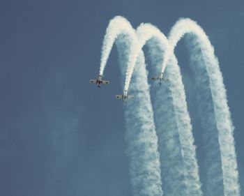 Low angle view of airplane against the sky