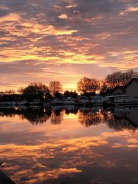 Scenic view of lake against orange sky