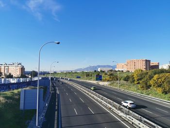 Highway in city against sky