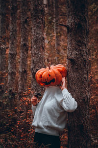 Halloween girl being nauthy in the forest