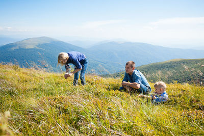 Rear view of two boys on mountain