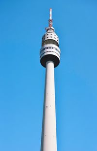 Low angle view of communications tower against clear sky