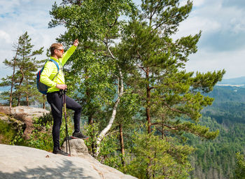 Side view of man standing on rock