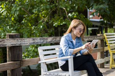 Young woman using digital tablet