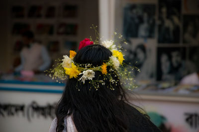 Rear view of woman with bouquet