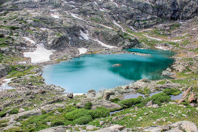 High angle view of lake amidst rocks