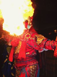 Midsection of man and woman standing in traditional clothing