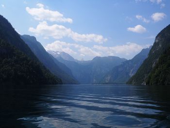 Scenic view of lake and mountains against sky