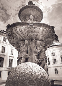 Low angle view of statue against building