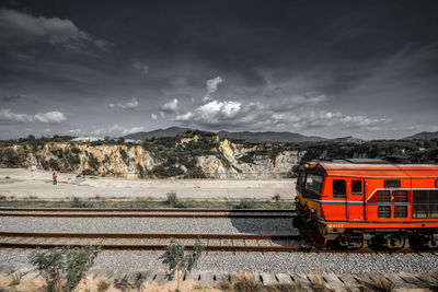 Train on railroad track against sky