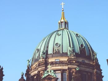 Low angle view of church against blue sky