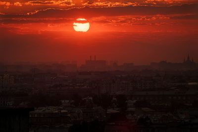 High angle view of buildings against sky during sunset