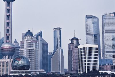 Oriental pearl tower against modern buildings in city